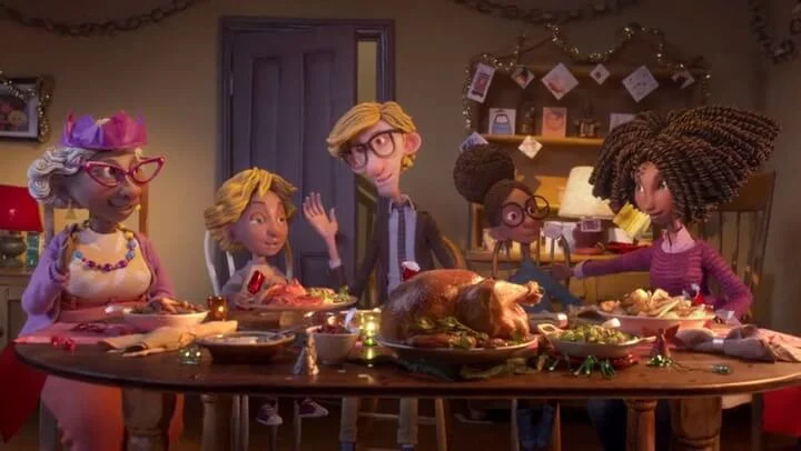 Captura de tela de uma animação da campanha da Sainsbury’s, mostrando uma família reunida à mesa para a ceia.
