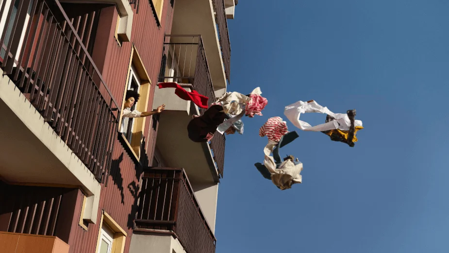 A still from the Zalando ad showing a person throwing out their ex’s clothes from the window