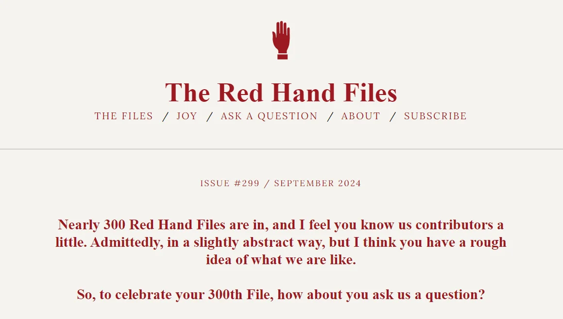 The Red Hand Files website screenshot, the header has the logo which is the silhouette drawing of a hand, the color scheme is burgundy on beige