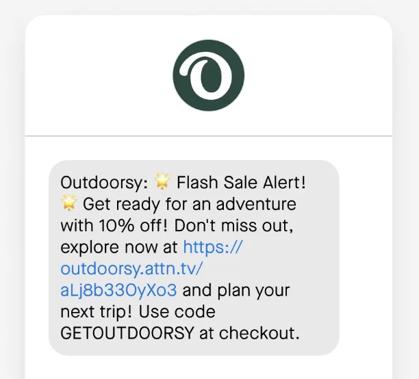 An Outdoorsy SMS with a link to shop the sale and two star emojis saying: “Outdoorsy: Flash Sale Alert! Get ready for an adventure with 10% off! Don't miss out, explore now at and plan your next trip! Use code GETOUTDOORSY at checkout.”