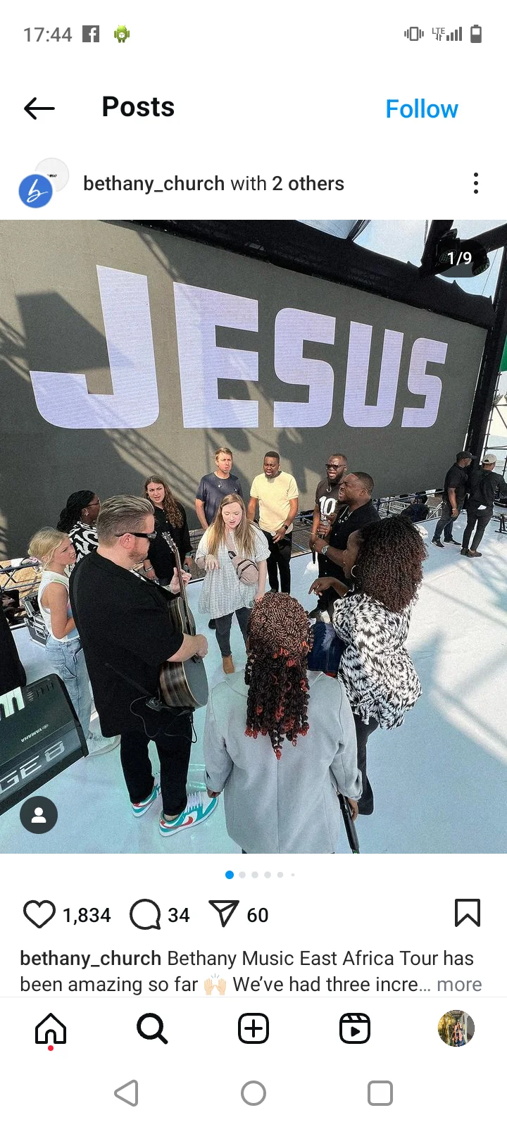 Instagram post showing a group of people gathered on stage at a church event with a large “Jesus” sign in the background