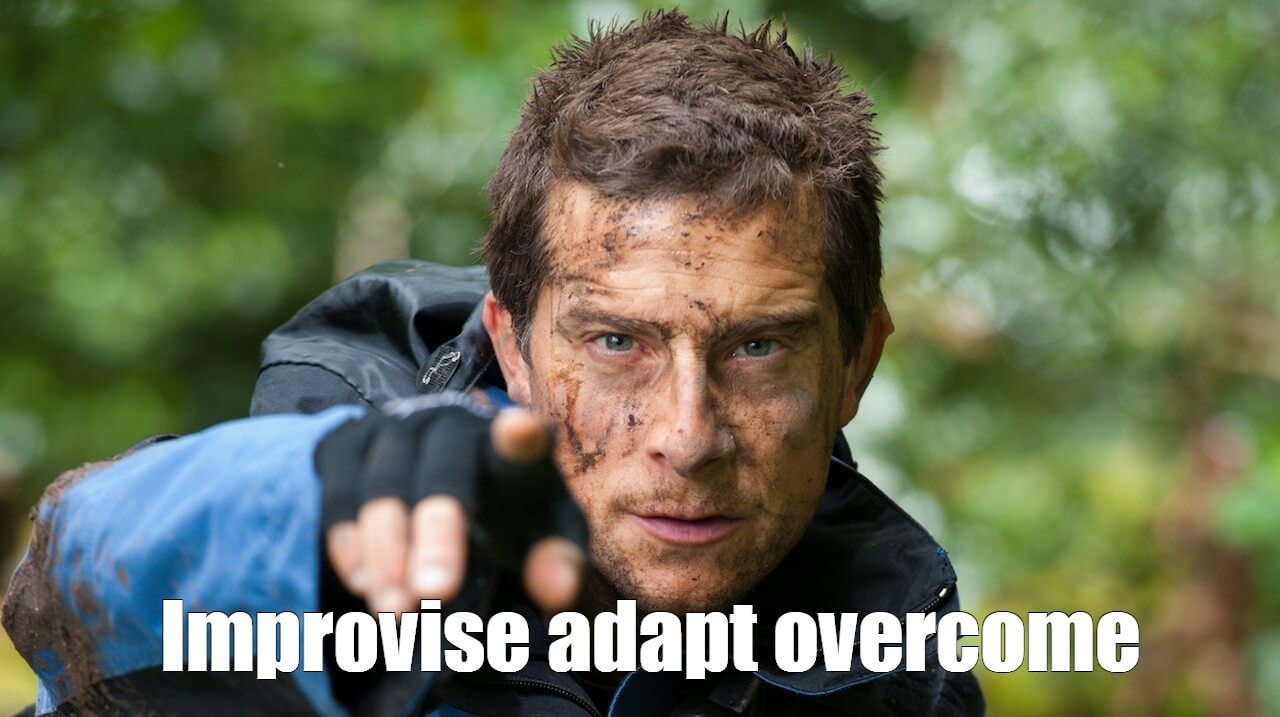 A picture of Bear Grylls from the reality television series Man vs. Wild and the subtitle "Improvise. Adapt. Overcome."