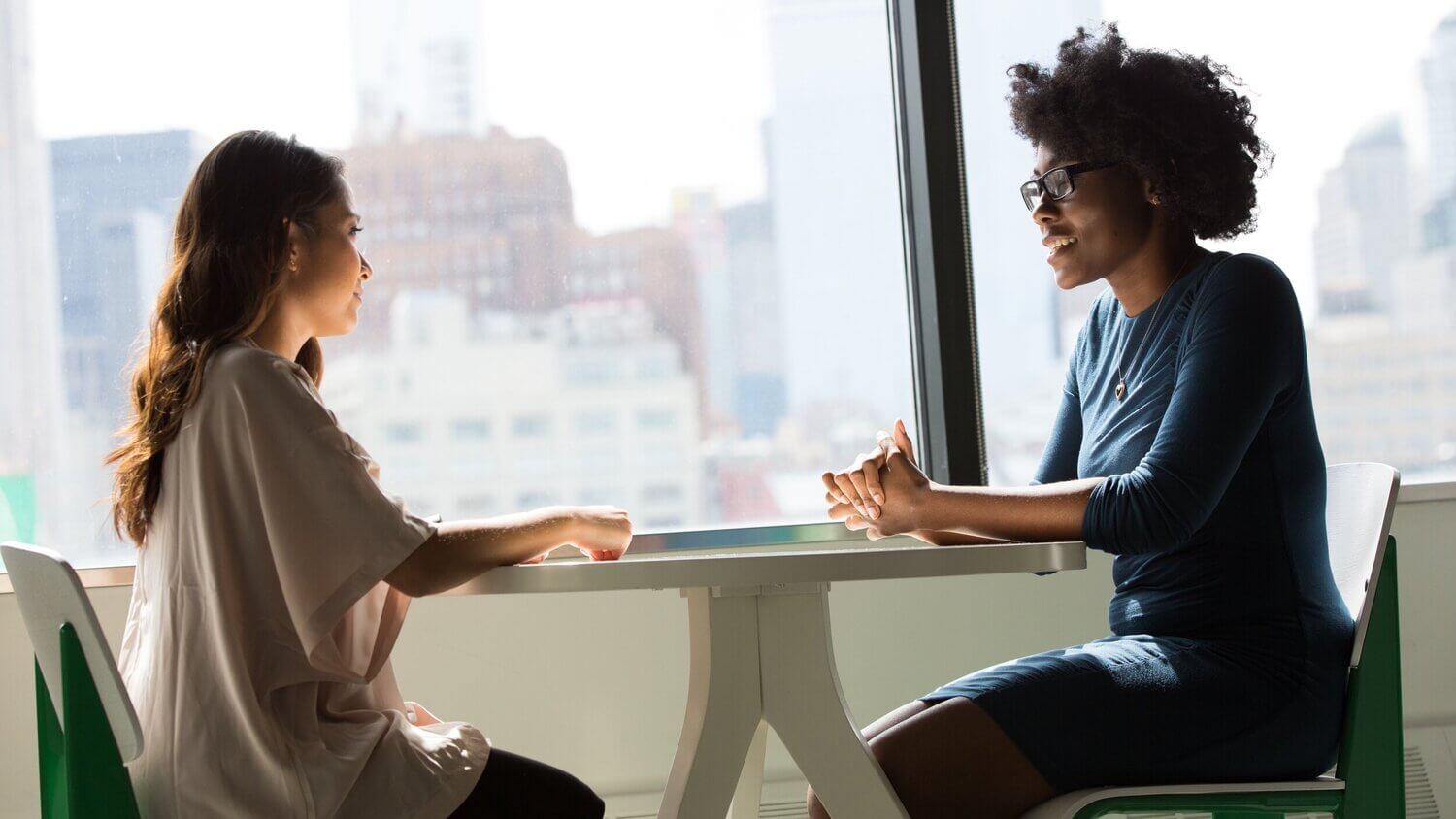 Inclusive stock photo of a black woman boss and employee