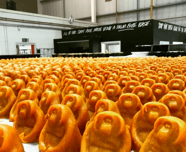 Orange soap in the shape of a sitting orangutan