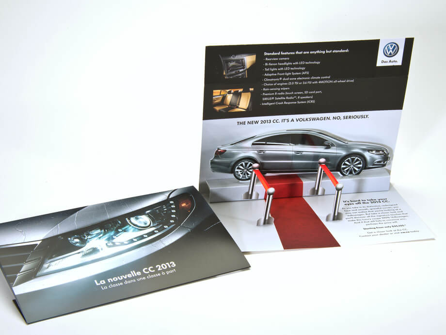 A promotional flyer from Volkswagen with a pop-up red carpet fence