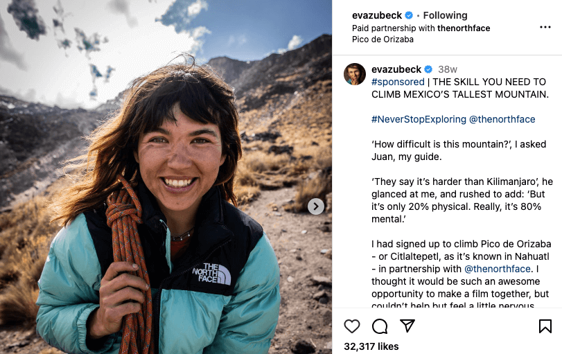 Sponsored influencer post of a woman climbing Pico de Orizaba, Mexico, wearing an The North Face jacket and promoting their collaboration
