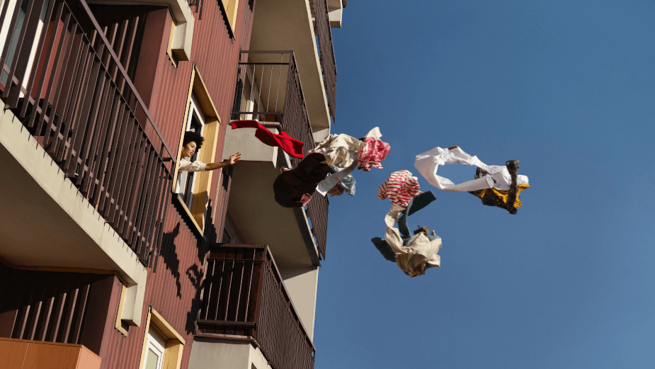 A still from the Zalando ad showing a person throwing out their ex’s clothes from the window